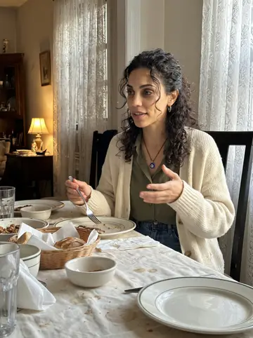 Helena, AI character: her yia-yia's apartment dining table in Astoria, plates of Sunday food crowded around her