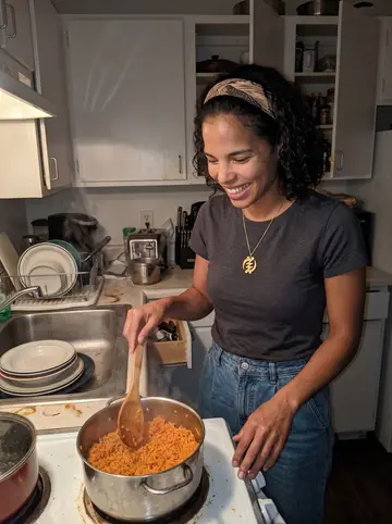 Ngozi, AI character: her small Seattle apartment kitchen late at night, a pot of jollof rice on the stove and dishes stacked by…