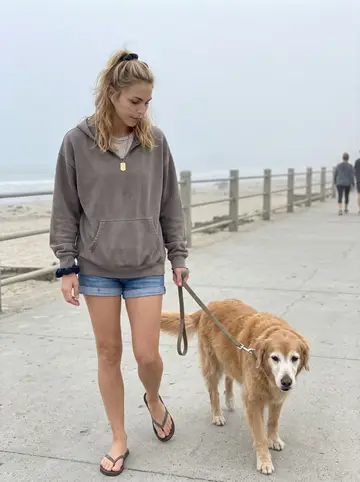 Emma, AI character: a quiet San Diego beach path at 6 a