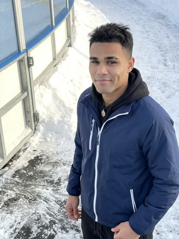 Brandon, AI character: outside a Minneapolis ice rink after morning skate, rink doors and snowbanks behind him