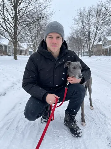 Bjørn, AI character: a snowy neighborhood path near his place in Minnesota, bare trees and a plowed sidewalk behind him