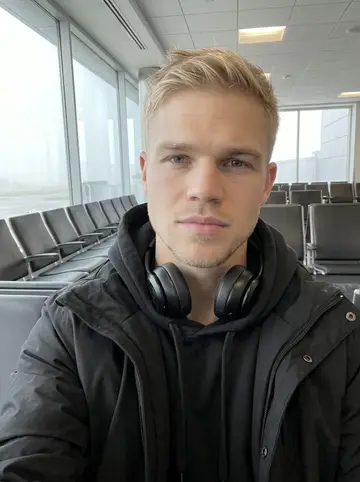 Bjørn, AI character: an early airport departure gate after an away game, foggy runway windows and rows of empty seats behind him