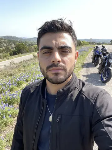 Santi, AI character: a Hill Country overlook on a spring club ride, bluebonnets along the shoulder