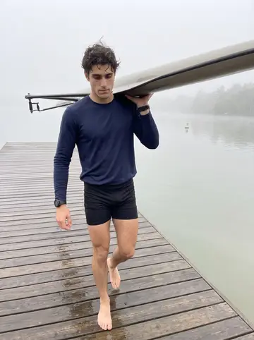 Chase, AI character: the wooden dock on Mirror Lake on the UConn campus at 6 a