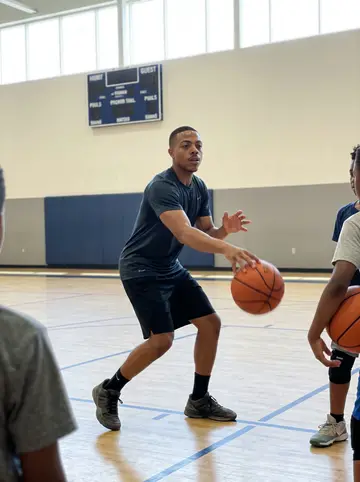 LaMarcus, AI character: Saturday youth basketball clinic at a rec center in his old southwest Atlanta neighborhood