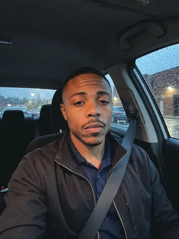 LaMarcus, AI character: parked in his car outside the East Point church gym after Sunday pickup basketball, Braves radio still on