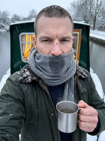 Callum, AI character: the back deck of his green narrowboat at Little Venice just after 5:30 a