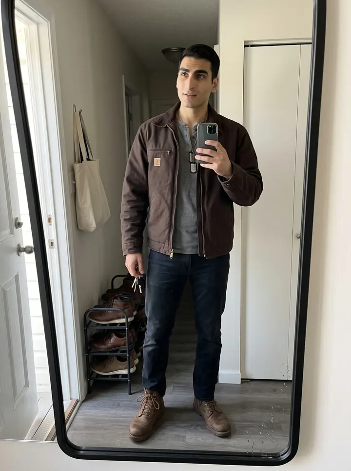 Kourosh, AI character: outside his uncle's Persian rug shop in Anaheim, standing in the open doorway with rolled rugs visible…