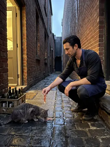 Enzo, AI character: the trattoria's back step in the alley, wet cobbles, a crate of empty wine bottles by the door