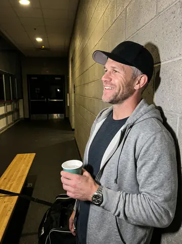 Wesley, AI character: the cinderblock lobby of a Bridgeport rink around midnight after his Thursday men's-league game, a hockey…