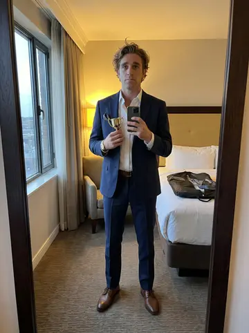 Cash, AI character: his small risk-pricing office in Atlantic City, a desk with two monitors, a whiteboard of odds tables…