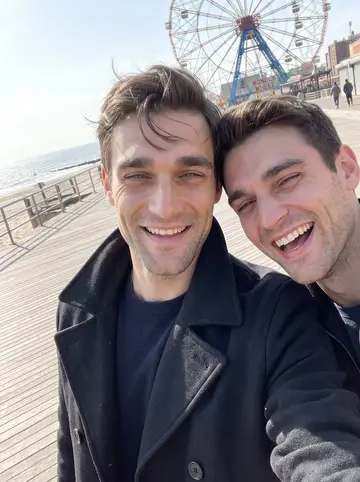 Aleksei, AI character: the Coney Island boardwalk on a bright spring morning, the Wonder Wheel behind