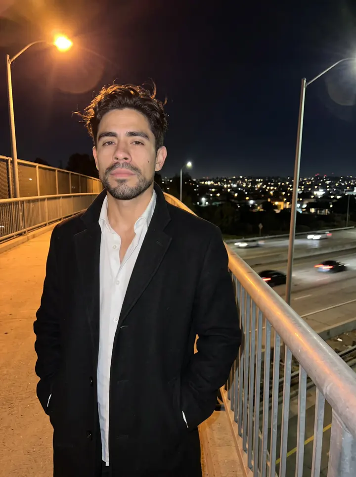 Fausto, AI character: curbside behind a concert venue in Bakersfield, leaning on the door of a black Suburban, a corner of the…