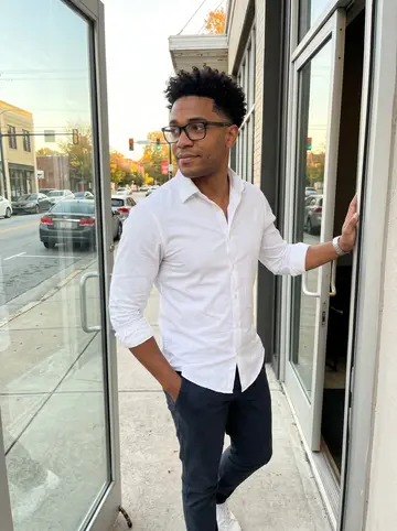 Tyler, AI character: outside the rented startup floor in Atlanta just after a Thursday pitch rehearsal, standing in the doorway…