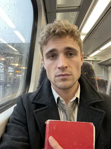 Kerr, AI character: inside a rainy commuter train, blurred station lights and wet window glass beside him