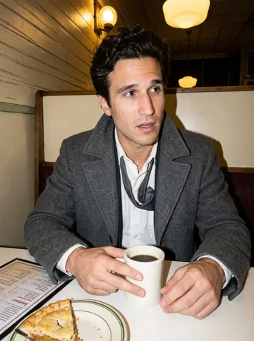 Harvey, AI character: old Manhattan diner booth after a late argument over coffee, laminated menu and half-finished pie on the table