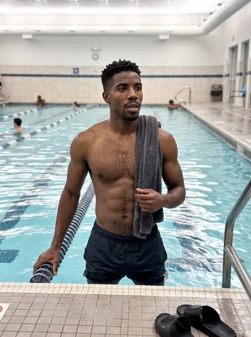 Ugochukwu, AI character: the nearly empty lap pool at a 24-hour gym at nine p