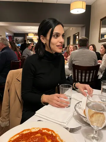 Gabriella, AI character: a crowded family Italian restaurant on Federal Hill during a Sunday dinner, red sauce plates and water…