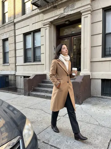 Cecilia, AI character: a Bay Ridge block she manages, cracked sidewalk and an old apartment entryway behind her