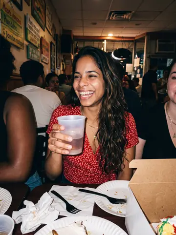 Jimena, AI character: a humid summer night at a small Dominican restaurant in Providence after dropping off a birthday cake for…