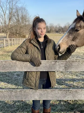 Skye, AI character: fence line on her family's property outside Louisville, a chestnut horse standing behind the rail in clean…