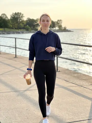 Laila, AI character: the Lake Michigan lakefront path in Milwaukee after work on a warm clear evening