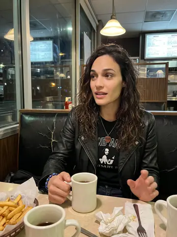 Melina, AI character: a Queens diner booth at 1 a