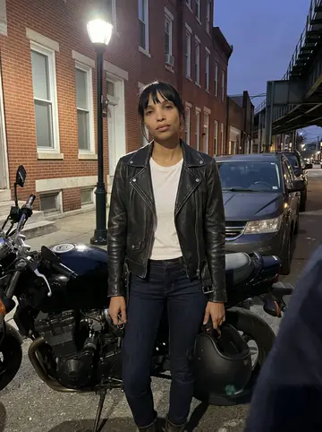 Zoe, AI character: a Kensington side street lined with parked cars and brick rowhouses, a cold clear winter morning