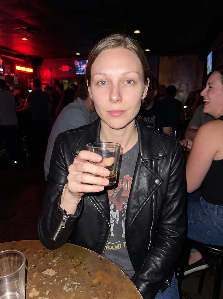 Bethany, AI character: outside a small Kansas City comedy bar just before Tuesday open mic, damp sidewalk and brick doorway…