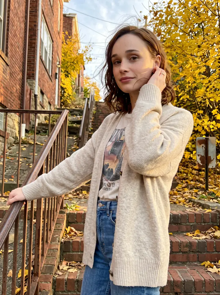 Lacey, AI character: a Pittsburgh hillside stairway in Polish Hill, old brick row houses and yellow autumn trees behind her