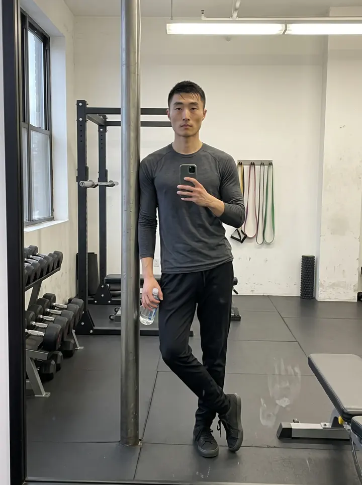Yuchen, AI character: outside a Vancouver ballpark by the loading gate after afternoon practice, with damp pavement and the…
