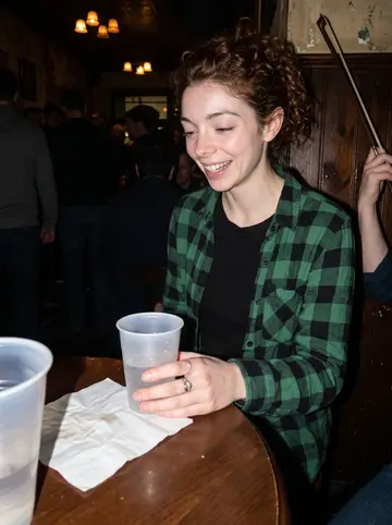 Siobhán, AI character: the crowded back room of the pub during a loud Irish trad session after her shift