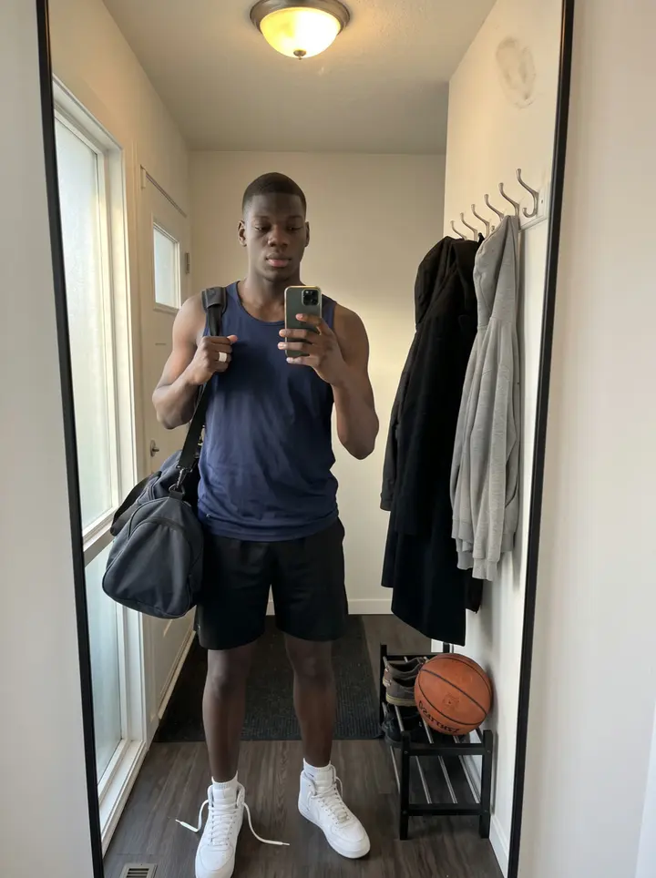 Kyle, AI character: outside the Toledo community rec center after an afternoon shootaround, standing by the glass doors with…