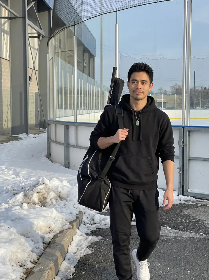 Jefferson, AI character: outside the team rink after a morning skate, snow piled along the parking lot curb and the arena glass…