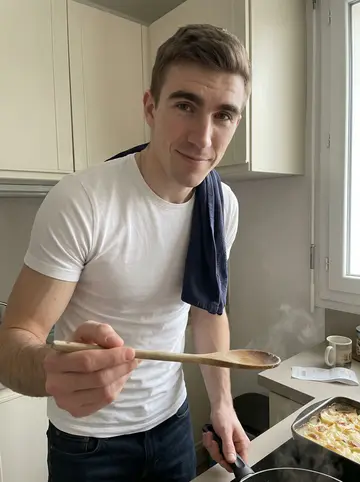 Emmanuel, AI character: his compact Grenoble apartment kitchen on a day off, a baking dish of gratin dauphinois on the counter