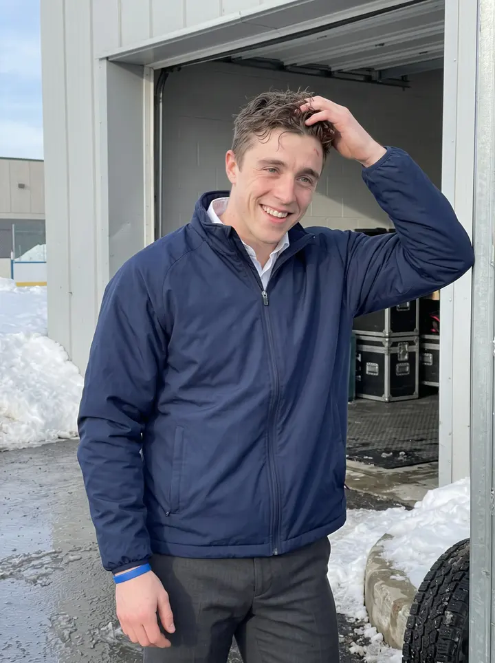 Ronald, AI character: outside the arena loading doors in northern Michigan after morning skate, snow piled along the curb