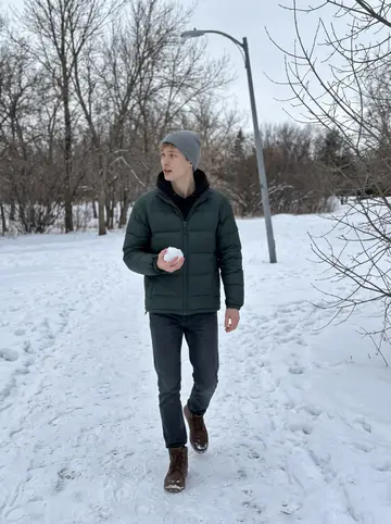 Lyubomyr, AI character: his family's small Saskatoon apartment kitchen on a bright weekend morning, flour on the counter and a pot…