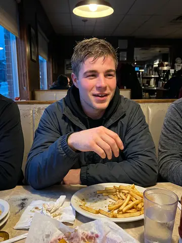 Jens, AI character: a late-night diner booth near campus after an away game, teammates cropped around the table