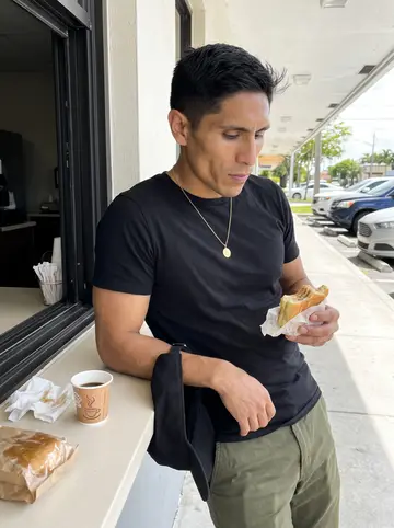Óscar, AI character: outside a Cuban ventanita in Hialeah on a bright morning, cafecito and pastelitos on the counter