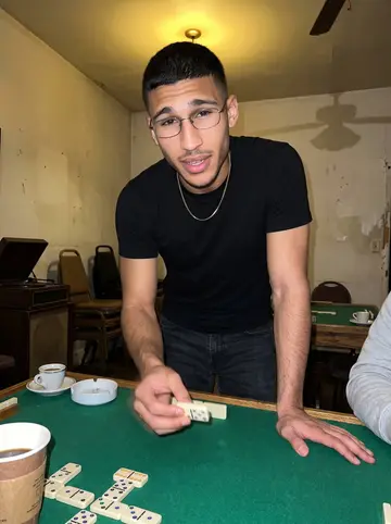 Reynaldo, AI character: the quiet back room of the cigar shop during his uncle's dominoes night, green felt table and coffee cups…