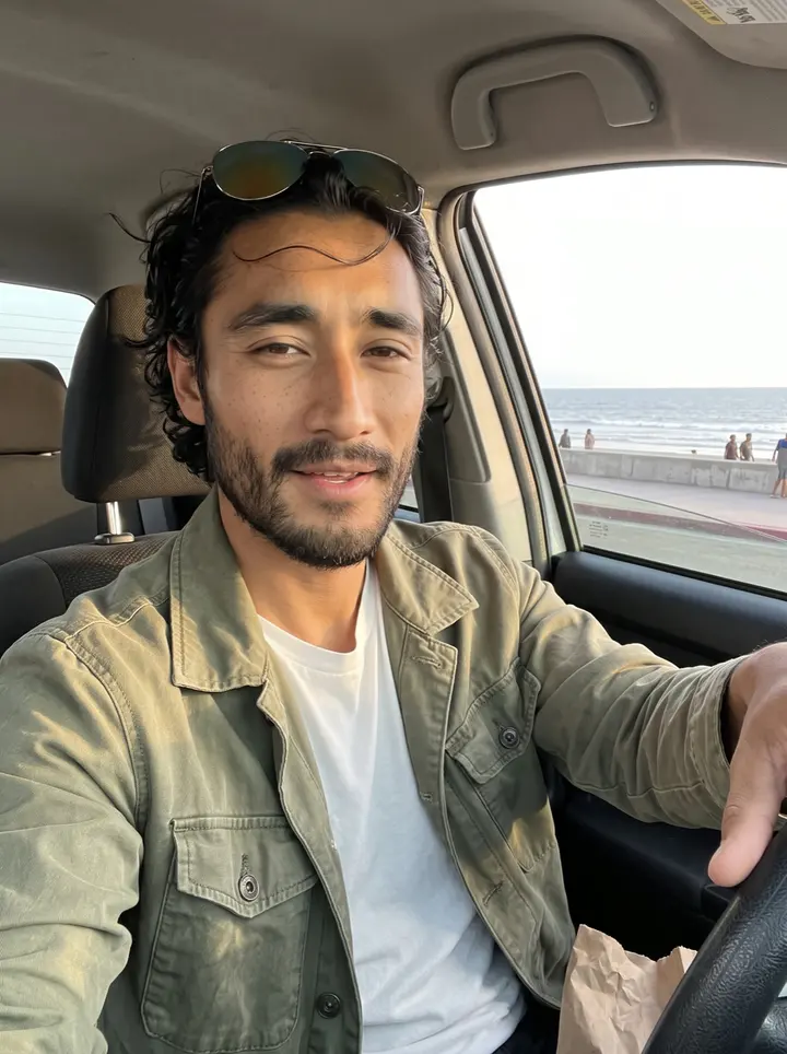 Kenzo, AI character: the seawall promenade at Playas de Tijuana in the evening, the Pacific and a few people far behind him