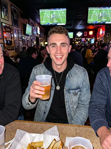 Samuel, AI character: crowded Pittsburgh sports bar during a Steelers game with his uncles just cropped out at the sides