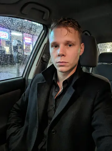Markus, AI character: an empty downtown Denver sidewalk at 5 a