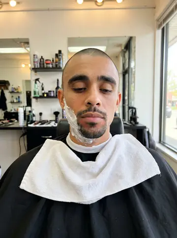 Luis, AI character: a North Philly row-house block early in the morning, walking along the sidewalk with parked cars and brick…