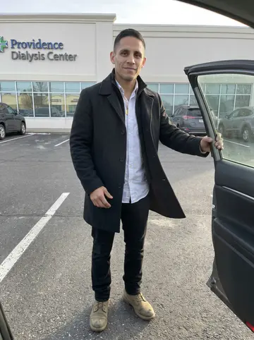Nicolas, AI character: parking lot outside a dialysis center in Providence on a cold clear morning, his grandmother just out of…