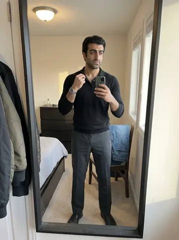 Omar, AI character: on the front line of the used-car lot on Michigan Avenue in Dearborn on a windy spring morning, rows of…