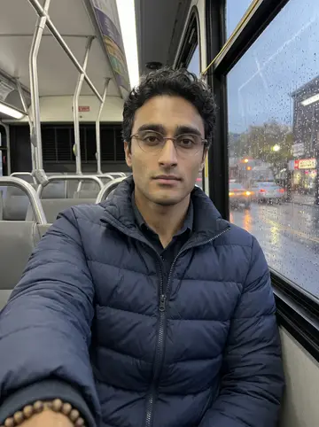 Hakan, AI character: inside a NJ Transit bus on a rainy evening route through Paterson after an early parole appointment