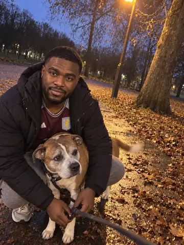 Owen, AI character: on the path of a Handsworth park at dusk, a streetlamp just come on
