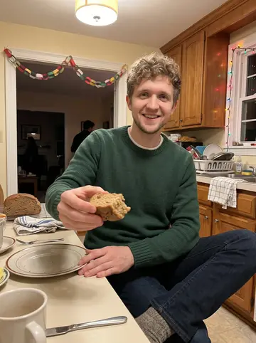 Eoin, AI character: his grandmother's Dorchester kitchen during a family holiday evening, brown bread cooling on the counter…