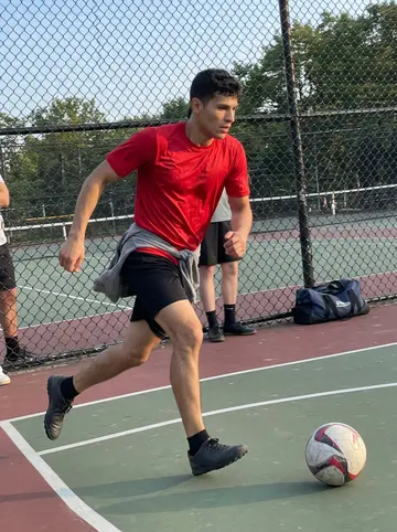 Bruno, AI character: Sunday pickup soccer at the Riverbank Park courts in Newark